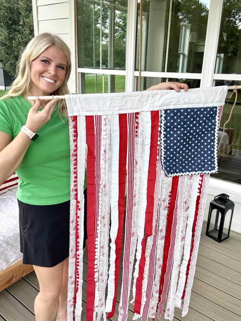 holding patriotic rag tag flag